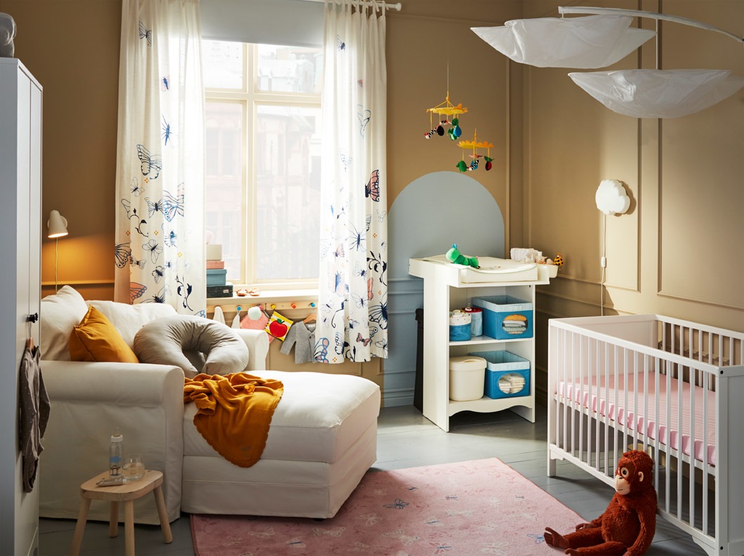 This cosy baby room offers everything you need, both in comfort and necessities. IKEA GRÖNLID is a comfy place to relax when nursing and cuddling. IKEA NÖJSAM baskets and boxes make diaper sessions on IKEA SOLGUL changing table as easy as they can be.