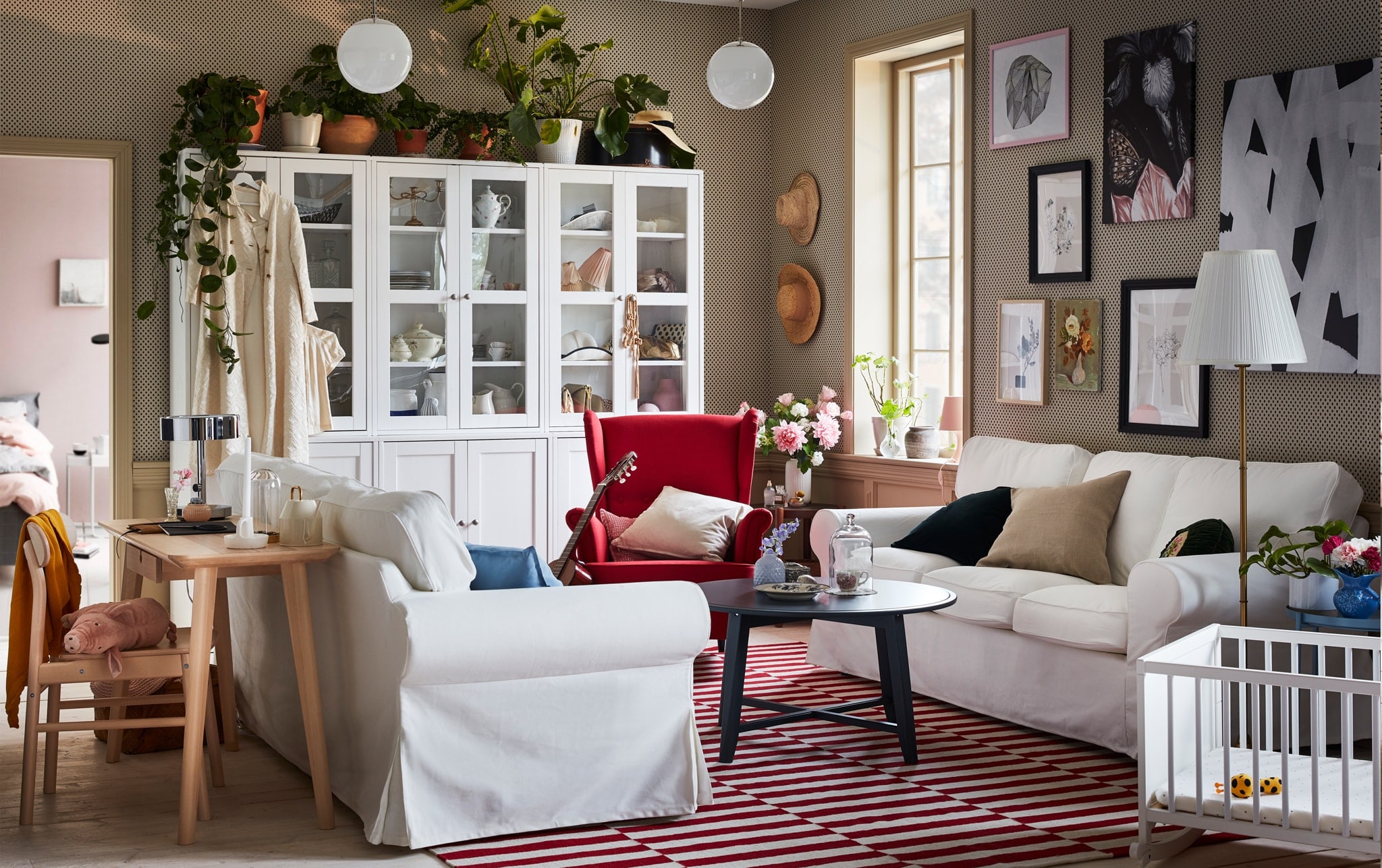  Two EKTORP sofas are placed facing each other in a modern yet traditional living room in white and red colours.