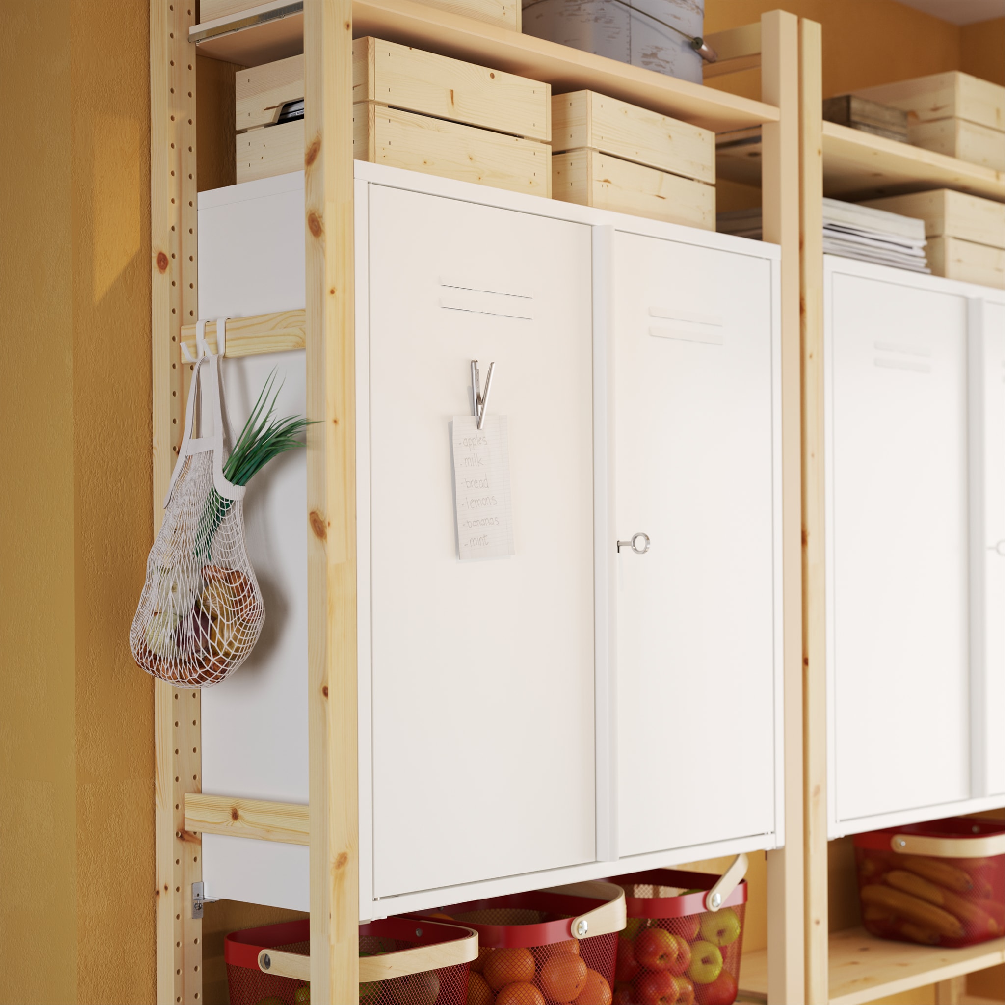  A kitchen cabinet door is open and shows VARIERA white shelf inserts inside that organises and divides plates, bowls and more.