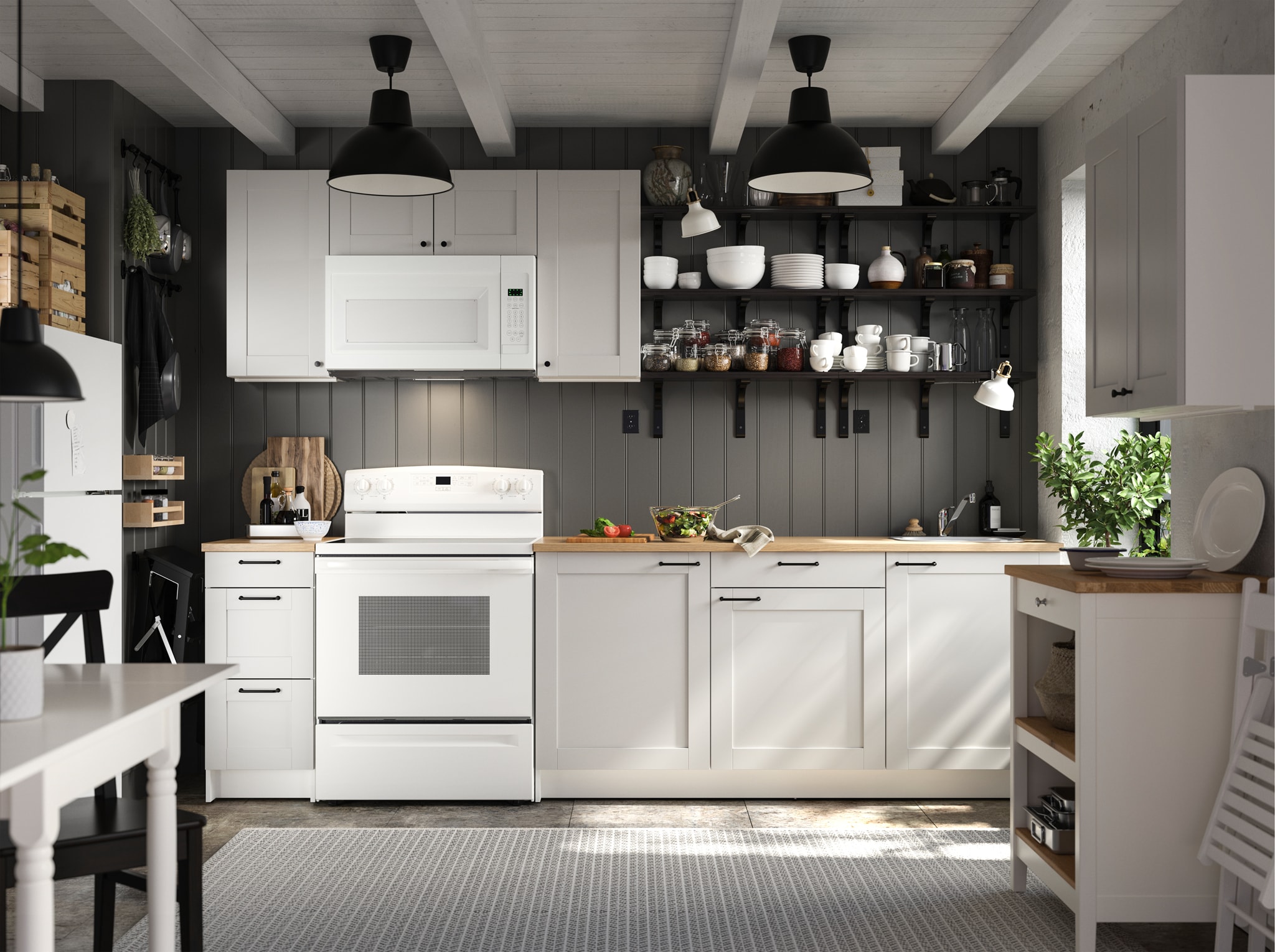  A KNOXHULT kitchen in light grey, black wall-mounted shelves, a white kitchen table, a black chair and a black pendant lamp.