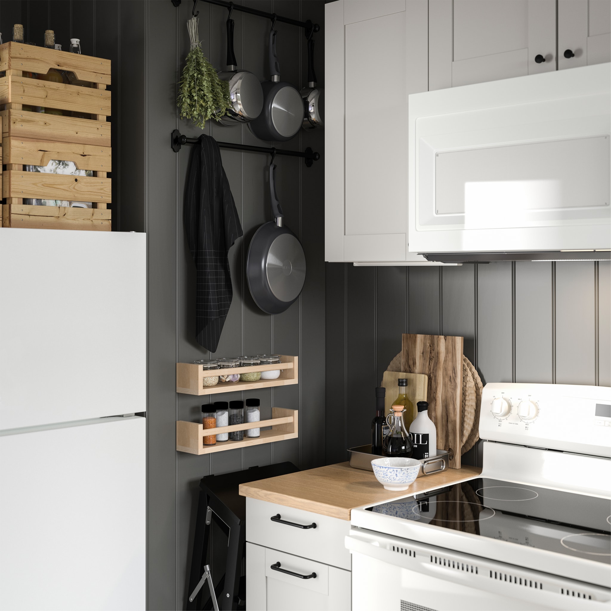  Two BEKVÄM spice racks in birch store spices and they are mounted on the wall right next to the stove.