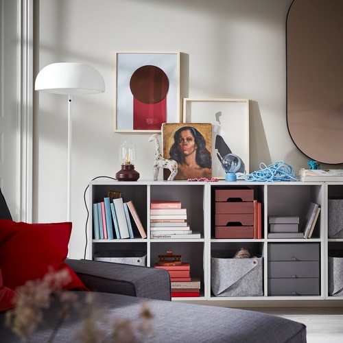 Wall-mounted EKET combination units in light grey offer open storage for books, baskets, boxes and more.