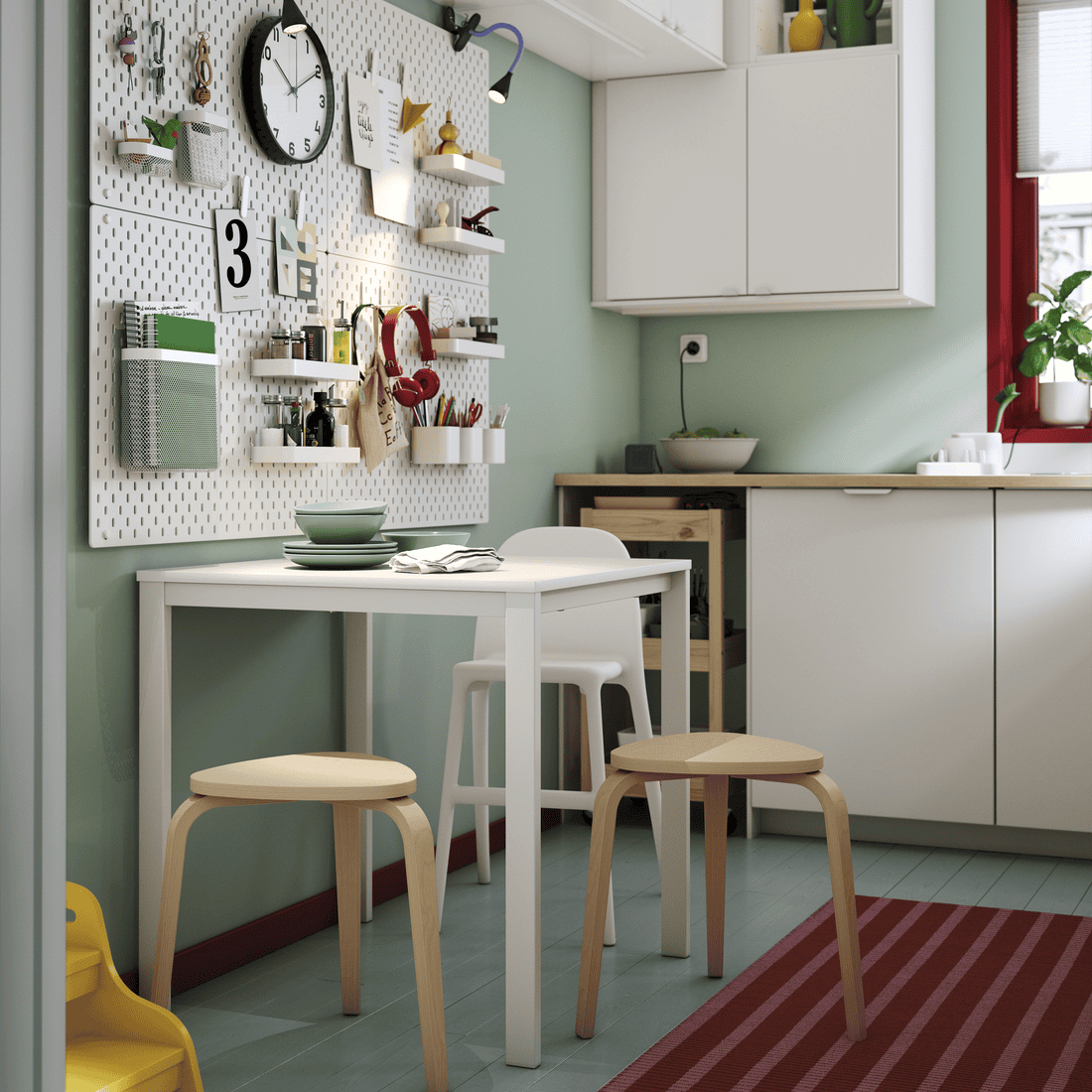 white table with wooden chairs and kitchen set in a dining room