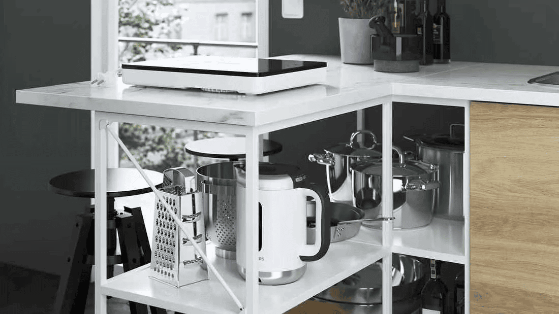 open white kitchen shelf for a kettle, pan, grater, and everyday cooking tools